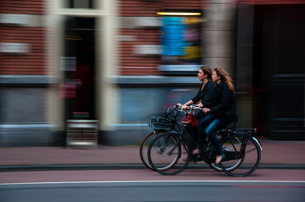 Two women riding their bikes